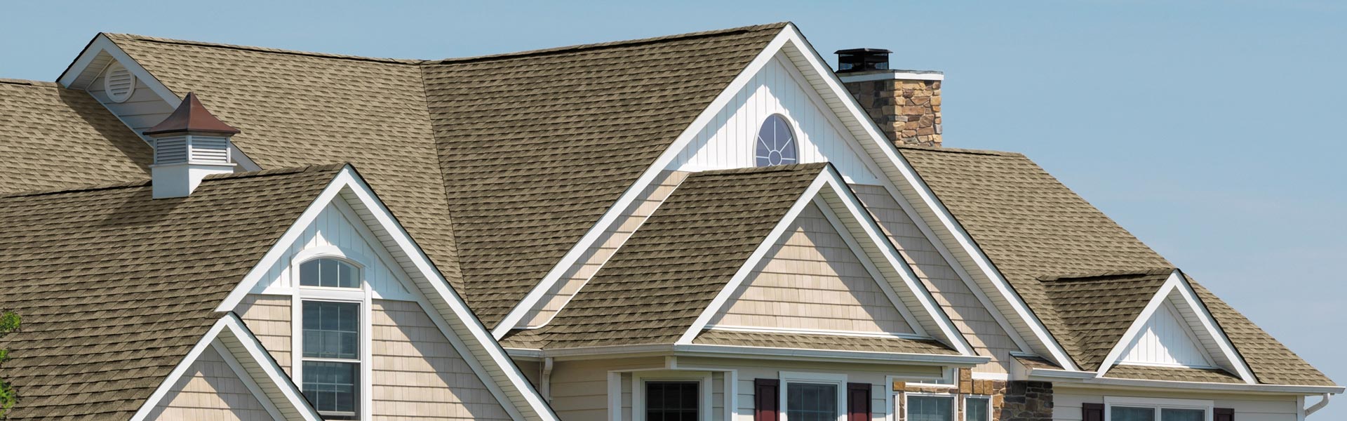 Home with a brown shingle roof