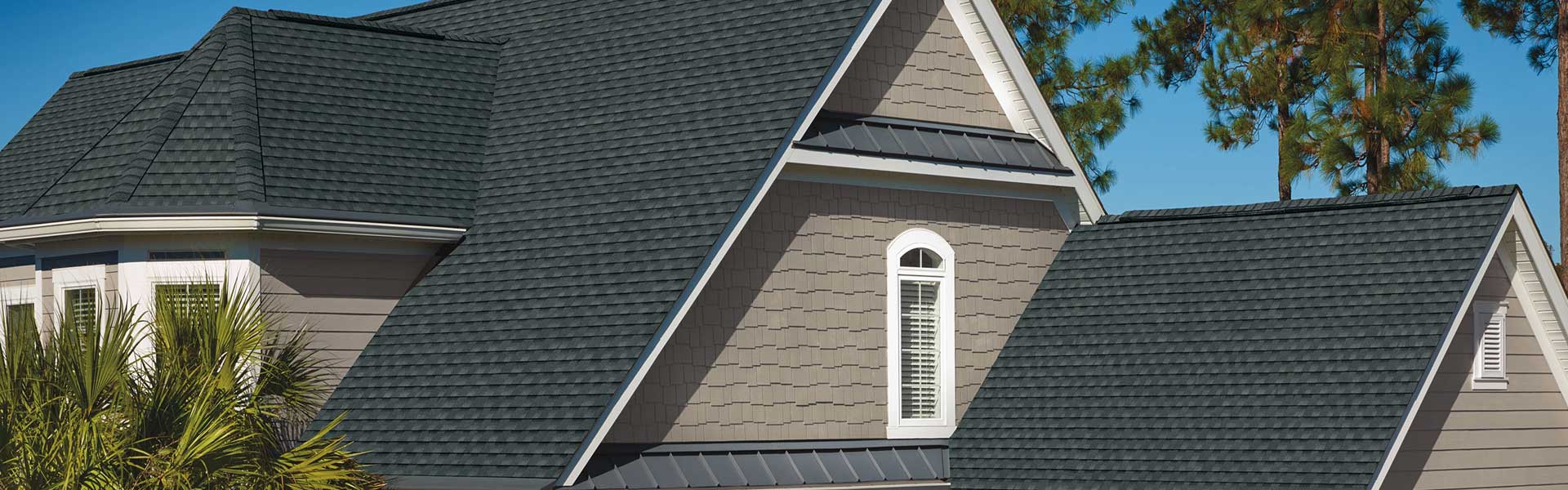 Home with a black shingle roof
